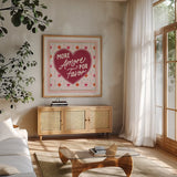 Blooming Hearts IV v2 by Laura Marshall. Shown in a natural wood frame in a cozy modern living room. Available as an archival giclee rolled canvas, fine art paper, or poster print. SKU 97409a.