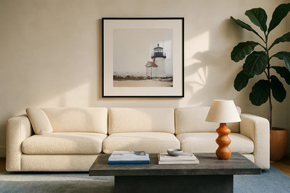 Brant Point Light by Laura Marshall. Displayed in a glass frame with matte in a clean modern living room. Available as an archival giclee rolled canvas, fine art paper, or poster print. SKU 38772a.