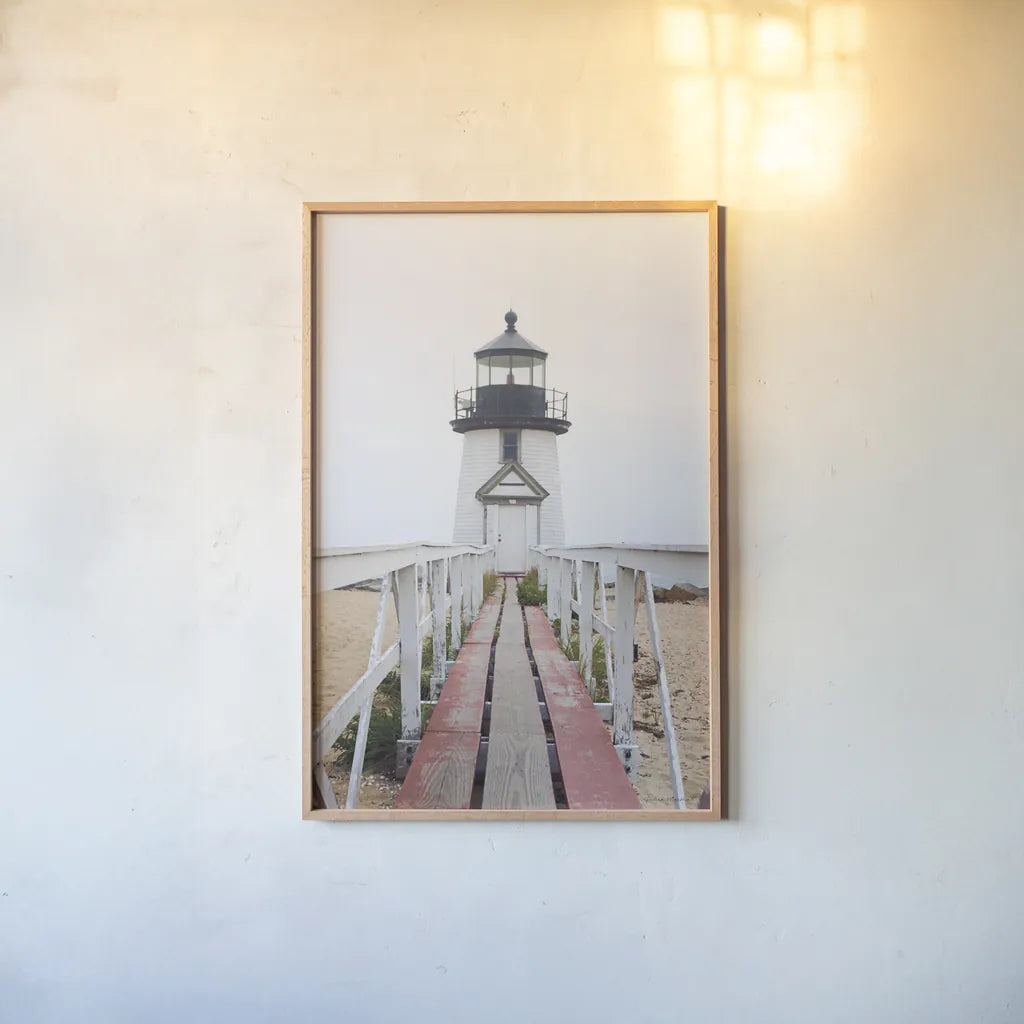 Brant Point Lighthouse by Laura Marshall. shown as a paper print in a natural frame. Available as a archival giclee rolled canvas, fine art paper, or poster print. SKU 39641h.