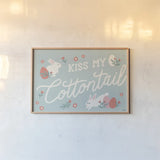 Bunny Kisses I v2 by Laura Marshall. shown as a paper print in a natural frame. Available as a archival giclee rolled canvas, fine art paper, or poster print. SKU 97390i.