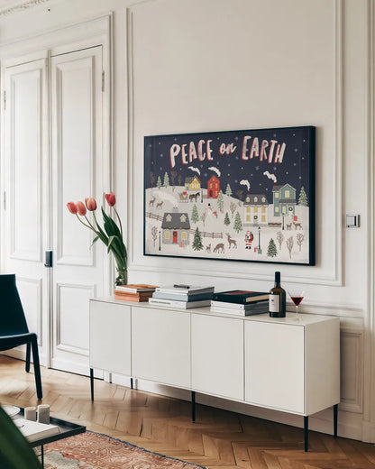 Christmas Village II by Laura Marshall. shown as a framed stretched canvas in a living room above a console. Available as a archival giclee rolled canvas, fine art paper, or poster print. SKU 48501i.