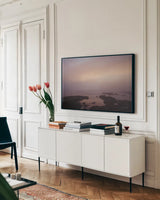 Crescent Bay I by Laura Marshall. shown as a framed stretched canvas in a living room above a console. Available as a archival giclee rolled canvas, fine art paper, or poster print. SKU 42967i.