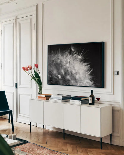 Dandelion Dewdrops I by Laura Marshall. shown as a framed stretched canvas in a living room above a console. Available as a archival giclee rolled canvas, fine art paper, or poster print. SKU 55010i.