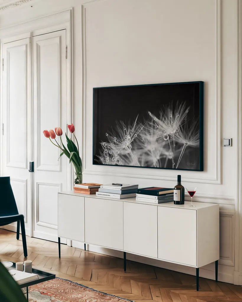 Dandelion Dewdrops II by Laura Marshall. shown as a framed stretched canvas in a living room above a console. Available as a archival giclee rolled canvas, fine art paper, or poster print. SKU 55011i.