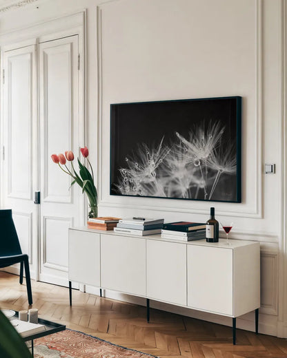 Dandelion Dewdrops II by Laura Marshall. shown as a framed stretched canvas in a living room above a console. Available as a archival giclee rolled canvas, fine art paper, or poster print. SKU 55011i.