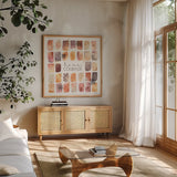 Desert Blooms V by Laura Marshall. Shown in a natural wood frame in a cozy modern living room. Available as an archival giclee rolled canvas, fine art paper, or poster print. SKU 64846a.