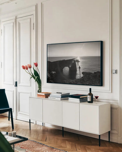 Dyrholaey by Laura Marshall. shown as a framed stretched canvas in a living room above a console. Available as a archival giclee rolled canvas, fine art paper, or poster print. SKU 64398i.