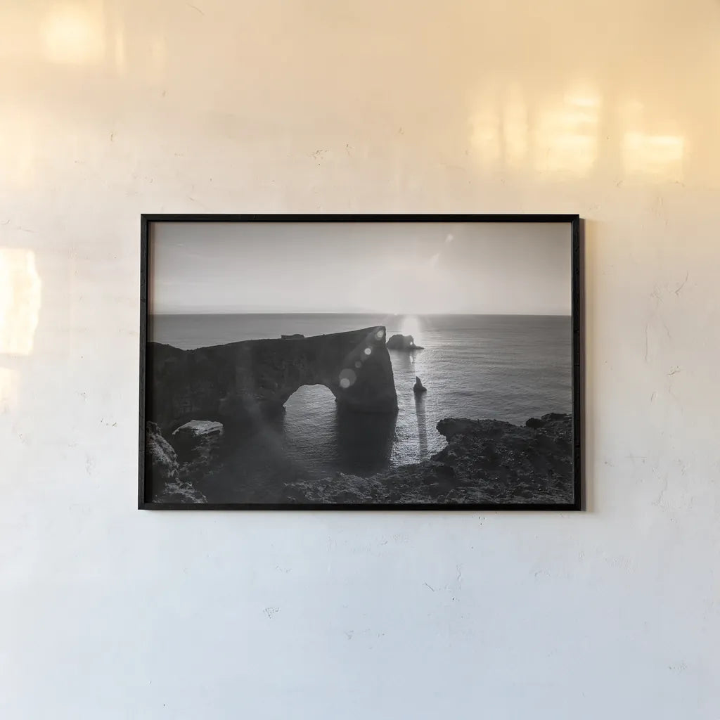 Dyrholaey by Laura Marshall. shown as a paper print in a black flame. Available as a archival giclee rolled canvas, fine art paper, or poster print. SKU 64398i.