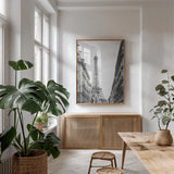 Eiffel Glimpse by Laura Marshall. shown as a print in a natural wood frame in a dining room. Available as a archival giclee rolled canvas, fine art paper, or poster print. SKU 25887h.