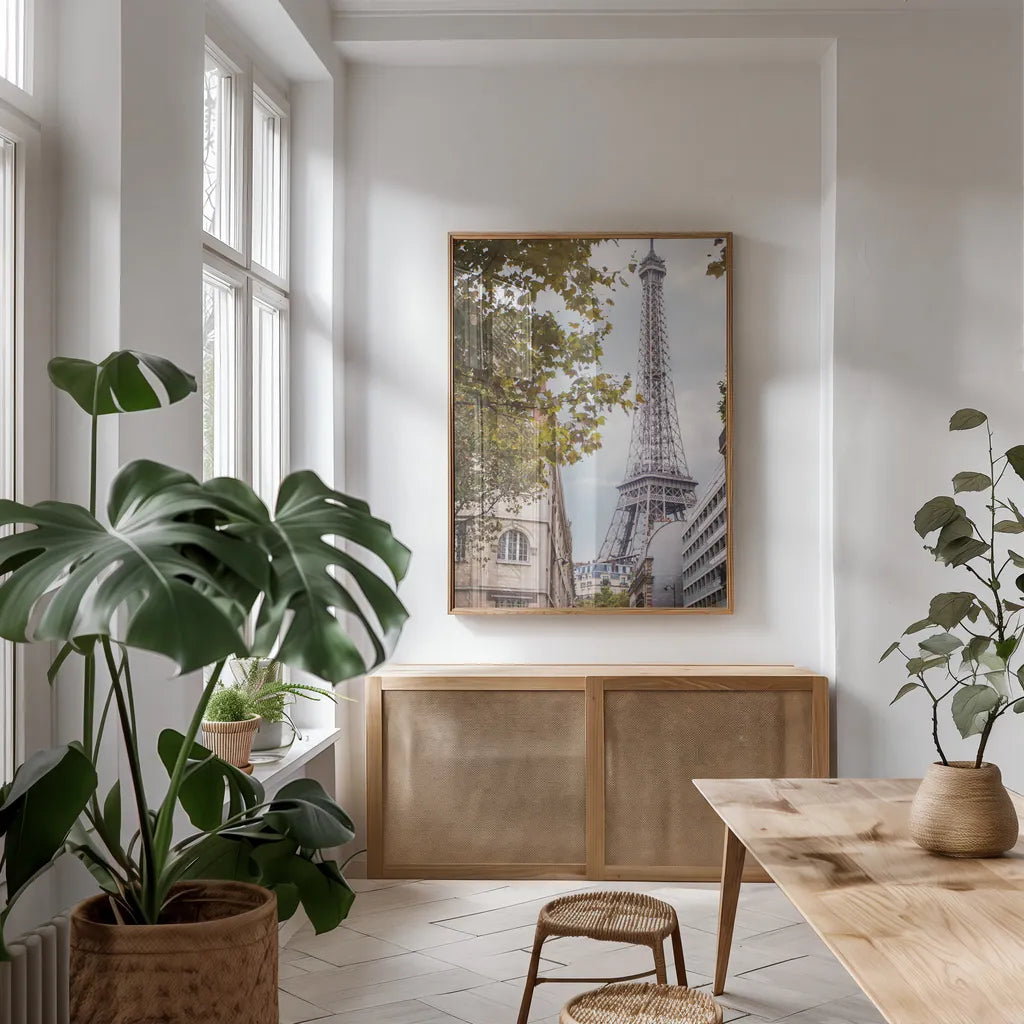 Eiffel View II by Laura Marshall. shown as a print in a natural wood frame in a dining room. Available as a archival giclee rolled canvas, fine art paper, or poster print. SKU 30543h.