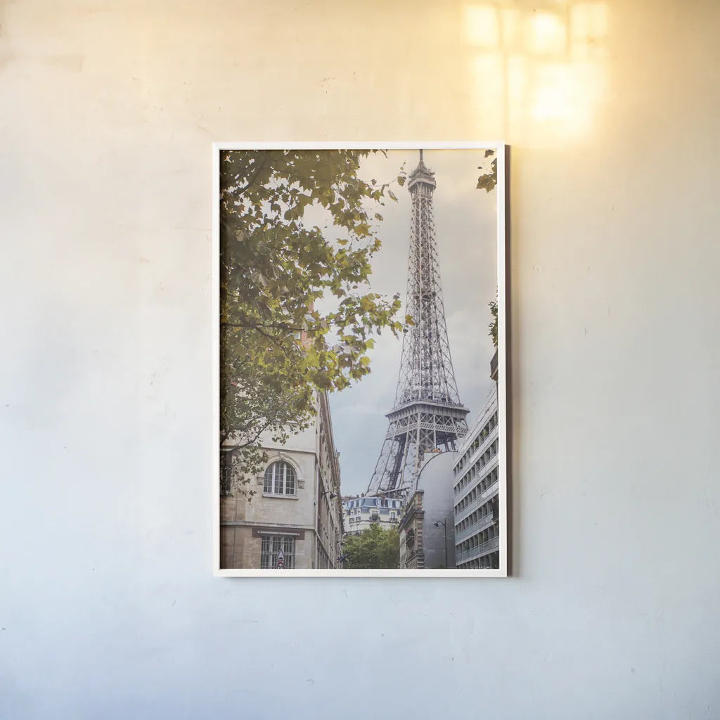 Eiffel View II by Laura Marshall. shown as a paper print in a white frame. Available as a archival giclee rolled canvas, fine art paper, or poster print. SKU 30543h.
