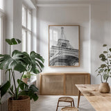 Eiffel up Close by Laura Marshall. shown as a print in a natural wood frame in a dining room. Available as a archival giclee rolled canvas, fine art paper, or poster print. SKU 25888h.