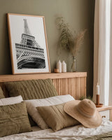 Eiffel up Close by Laura Marshall. shown as a paper print in a natural frame. Available as a archival giclee rolled canvas, fine art paper, or poster print. SKU 25888h.