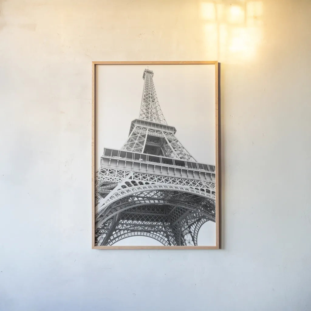 Eiffel up Close by Laura Marshall. shown as a paper print in a natural frame. Available as a archival giclee rolled canvas, fine art paper, or poster print. SKU 25888h.