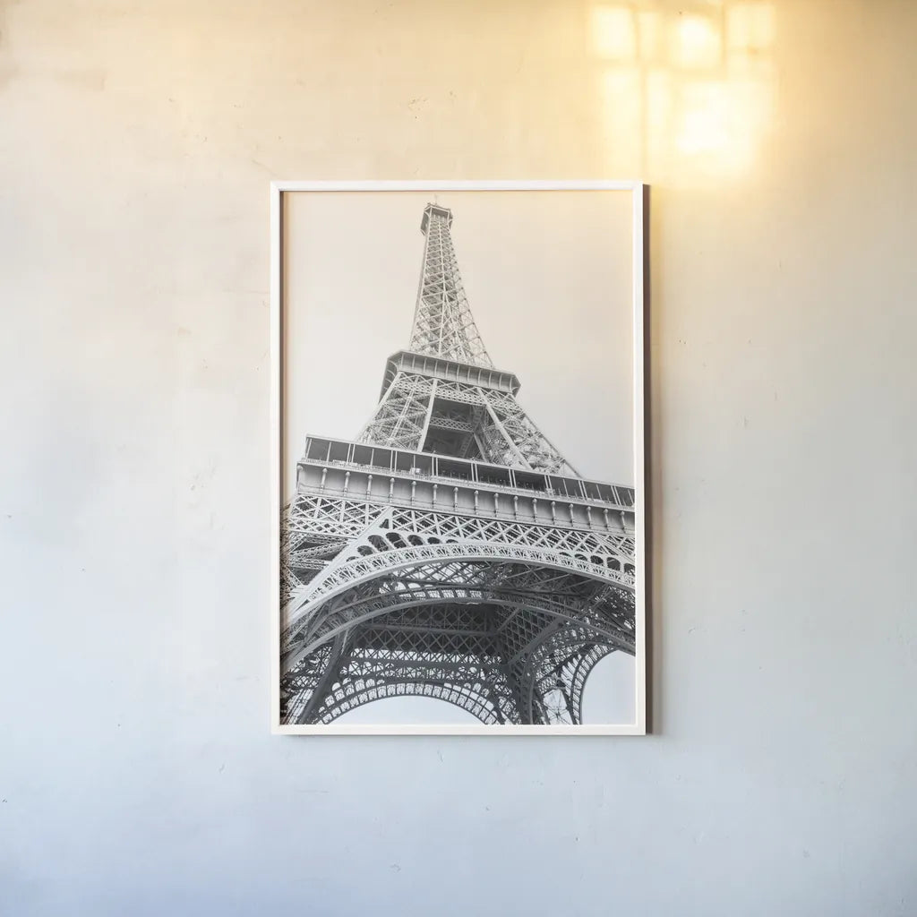 Eiffel up Close by Laura Marshall. shown as a paper print in a white frame. Available as a archival giclee rolled canvas, fine art paper, or poster print. SKU 25888h.