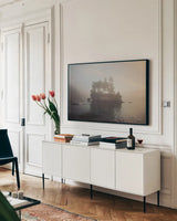 First Light by Laura Marshall. shown as a framed stretched canvas in a living room above a console. Available as a archival giclee rolled canvas, fine art paper, or poster print. SKU 42969i.
