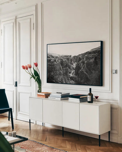 Fjadrargljufur by Laura Marshall. shown as a framed stretched canvas in a living room above a console. Available as a archival giclee rolled canvas, fine art paper, or poster print. SKU 64393i.