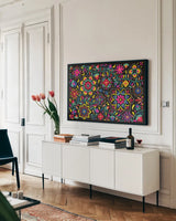 Floral Fiesta I by Laura Marshall. shown as a framed stretched canvas in a living room above a console. Available as a archival giclee rolled canvas, fine art paper, or poster print. SKU 41498i.