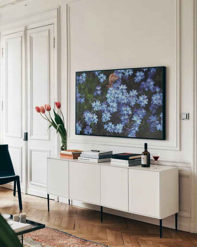Forget Me Nots III by Laura Marshall. shown as a framed stretched canvas in a living room above a console. Available as a archival giclee rolled canvas, fine art paper, or poster print. SKU 63261i.
