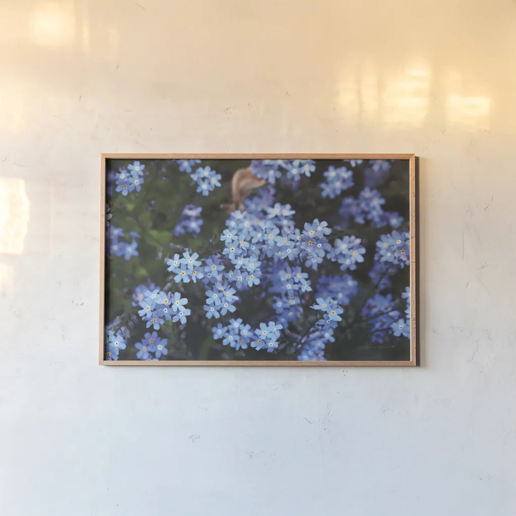 Forget Me Nots III by Laura Marshall. shown as a paper print in a natural frame. Available as a archival giclee rolled canvas, fine art paper, or poster print. SKU 63261i.