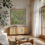 Garden Succulents I Color by Laura Marshall. Shown in a natural wood frame in a cozy modern living room. Available as an archival giclee rolled canvas, fine art paper, or poster print. SKU 33277a.