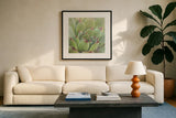 Garden Succulents I Color by Laura Marshall. Displayed in a glass frame with matte in a clean modern living room. Available as an archival giclee rolled canvas, fine art paper, or poster print. SKU 33277a.
