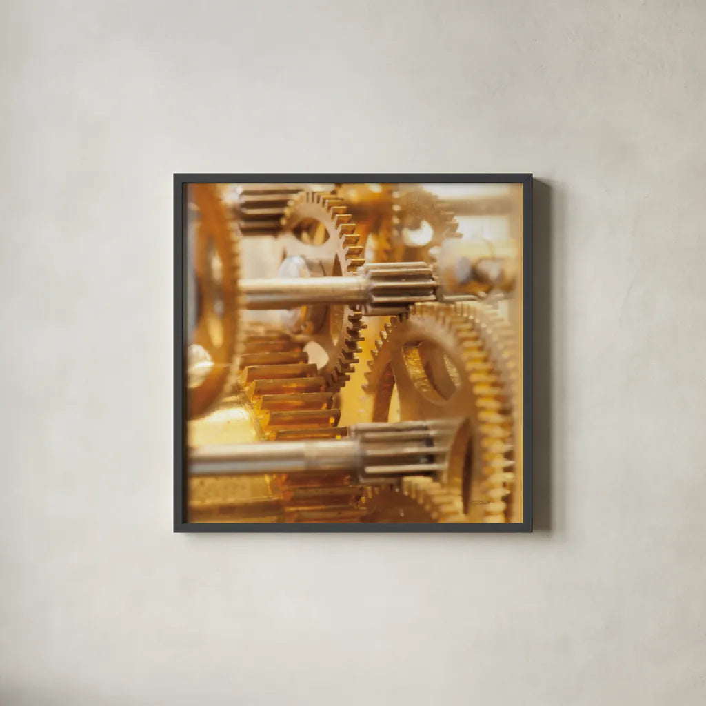 Gilded Gears I by Laura Marshall. Shown in a sleek black glass frame for a contemporary gallery look. Available as an archival giclee rolled canvas, fine art paper, or poster print. SKU 25869a.