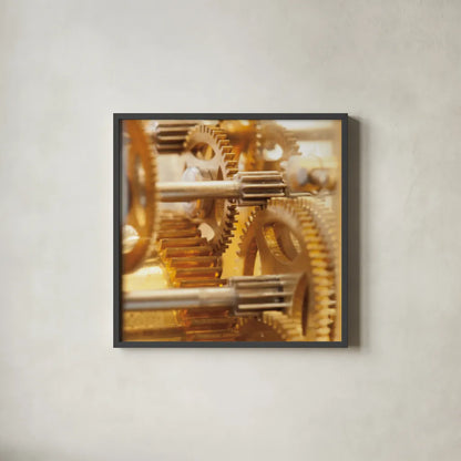 Gilded Gears I by Laura Marshall. Shown in a sleek black glass frame for a contemporary gallery look. Available as an archival giclee rolled canvas, fine art paper, or poster print. SKU 25869a.