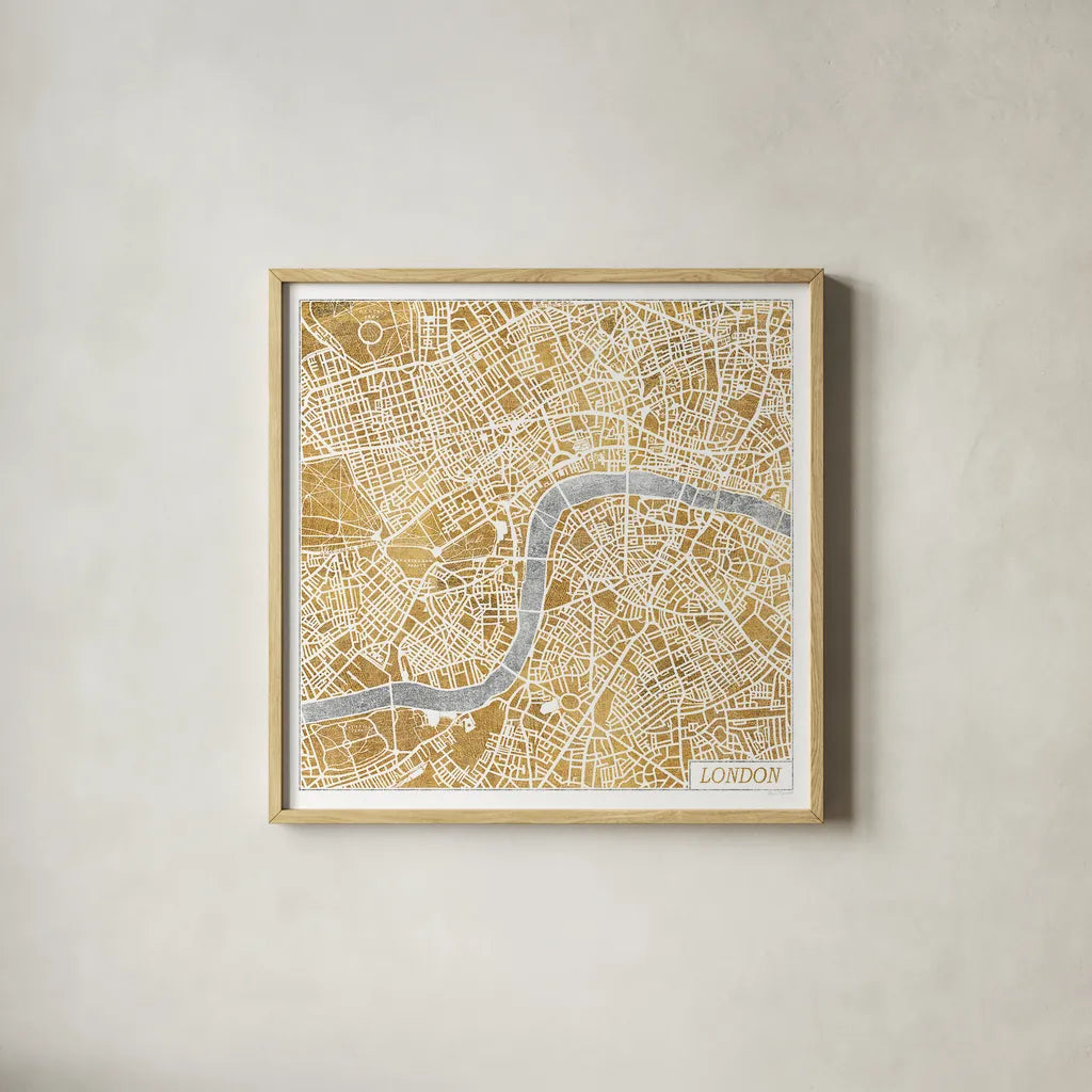 Gilded London Map by Laura Marshall. Shown in a natural wood glass frame for a timeless modern aesthetic. Available as an archival giclee rolled canvas, fine art paper, or poster print. SKU 17664a.