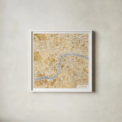 Gilded London Map by Laura Marshall. Shown in a crisp white glass frame for a clean and minimalist style. Available as an archival giclee rolled canvas, fine art paper, or poster print. SKU 17664a.