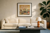 Harvest Village III by Laura Marshall. Displayed in a glass frame with matte in a clean modern living room. Available as an archival giclee rolled canvas, fine art paper, or poster print. SKU 50362a.