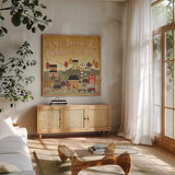 Harvest Village III Script by Laura Marshall. Shown in a natural wood frame in a cozy modern living room. Available as an archival giclee rolled canvas, fine art paper, or poster print. SKU 62640a.