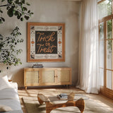 Haunted Harvest II by Laura Marshall. Shown in a natural wood frame in a cozy modern living room. Available as an archival giclee rolled canvas, fine art paper, or poster print. SKU 94151a.