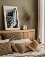 Hidden Waterfall by Laura Marshall. shown as a paper print in a natural frame. Available as a archival giclee rolled canvas, fine art paper, or poster print. SKU 64394h.