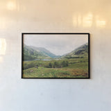 Highland Mountains by Laura Marshall. shown as a paper print in a black flame. Available as a archival giclee rolled canvas, fine art paper, or poster print. SKU 81312i.