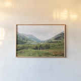 Highland Mountains by Laura Marshall. shown as a paper print in a natural frame. Available as a archival giclee rolled canvas, fine art paper, or poster print. SKU 81312i.