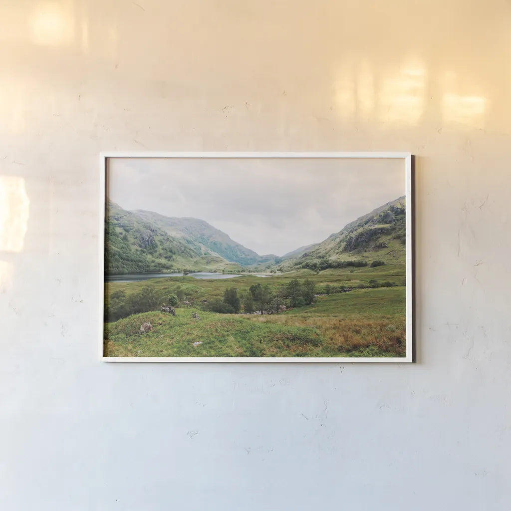 Highland Mountains by Laura Marshall. shown as a paper print in a white frame. Available as a archival giclee rolled canvas, fine art paper, or poster print. SKU 81312i.