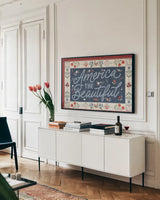 Homespun Americana I v2 by Laura Marshall. shown as a framed stretched canvas in a living room above a console. Available as a archival giclee rolled canvas, fine art paper, or poster print. SKU 104921i.