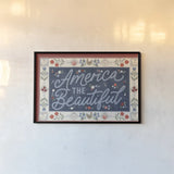 Homespun Americana I v2 by Laura Marshall. shown as a paper print in a black flame. Available as a archival giclee rolled canvas, fine art paper, or poster print. SKU 104921i.