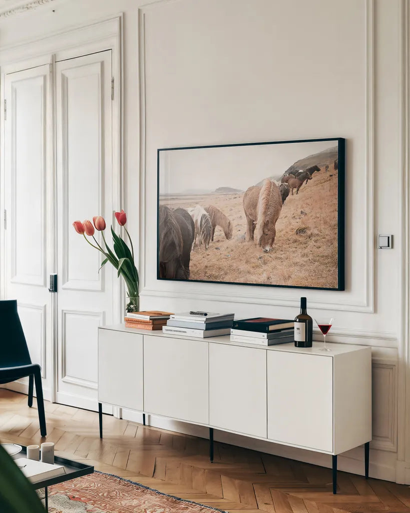 Horses of Hofn II by Laura Marshall. shown as a framed stretched canvas in a living room above a console. Available as a archival giclee rolled canvas, fine art paper, or poster print. SKU 49812i.