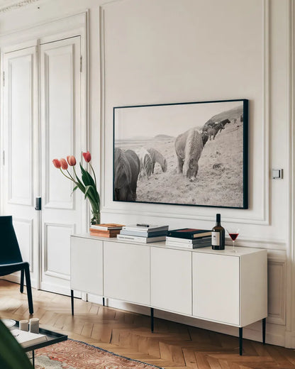Horses of Hofn II BW by Laura Marshall. shown as a framed stretched canvas in a living room above a console. Available as a archival giclee rolled canvas, fine art paper, or poster print. SKU 49813i.