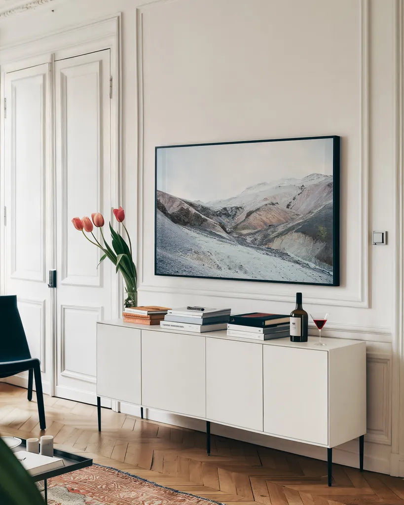 Iceland Hills I by Laura Marshall. shown as a framed stretched canvas in a living room above a console. Available as a archival giclee rolled canvas, fine art paper, or poster print. SKU 63269i.
