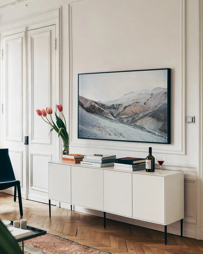 Iceland Hills I by Laura Marshall. shown as a framed stretched canvas in a living room above a console. Available as a archival giclee rolled canvas, fine art paper, or poster print. SKU 63269i.