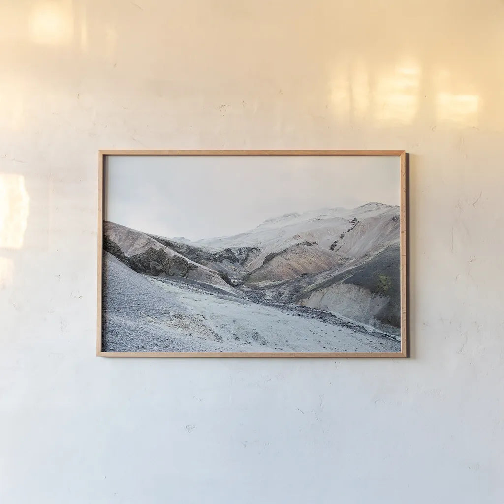 Iceland Hills I by Laura Marshall. shown as a paper print in a natural frame. Available as a archival giclee rolled canvas, fine art paper, or poster print. SKU 63269i.