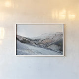 Iceland Hills I by Laura Marshall. shown as a paper print in a white frame. Available as a archival giclee rolled canvas, fine art paper, or poster print. SKU 63269i.
