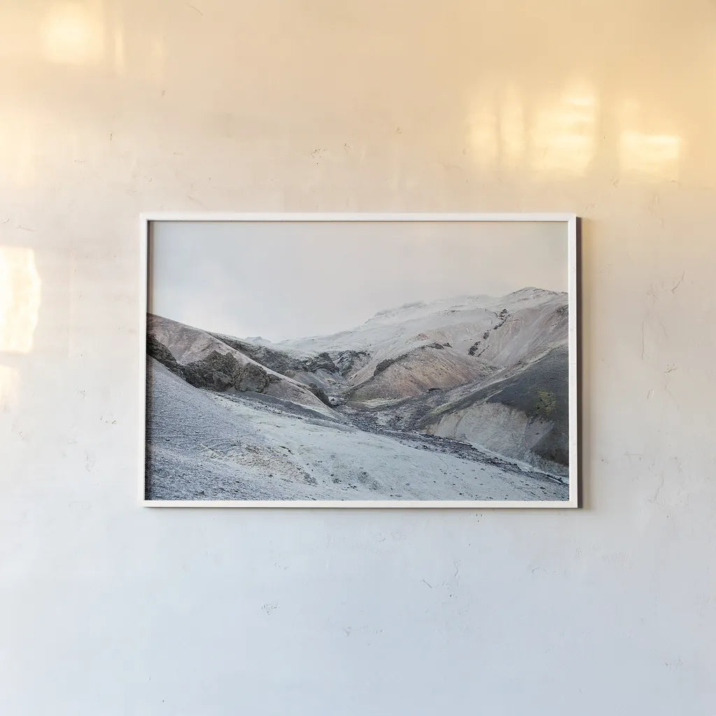 Iceland Hills I by Laura Marshall. shown as a paper print in a white frame. Available as a archival giclee rolled canvas, fine art paper, or poster print. SKU 63269i.