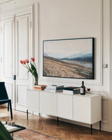 Iceland Hills II by Laura Marshall. shown as a framed stretched canvas in a living room above a console. Available as a archival giclee rolled canvas, fine art paper, or poster print. SKU 63270i.