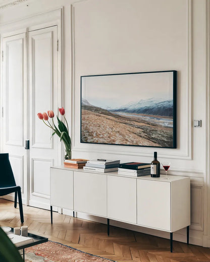 Iceland Hills II by Laura Marshall. shown as a framed stretched canvas in a living room above a console. Available as a archival giclee rolled canvas, fine art paper, or poster print. SKU 63270i.