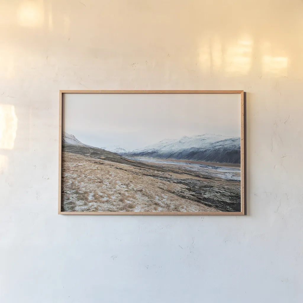 Iceland Hills II by Laura Marshall. shown as a paper print in a natural frame. Available as a archival giclee rolled canvas, fine art paper, or poster print. SKU 63270i.