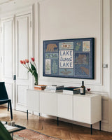 Lakeside Days VI Blue by Laura Marshall. shown as a framed stretched canvas in a living room above a console. Available as a archival giclee rolled canvas, fine art paper, or poster print. SKU 84700i.